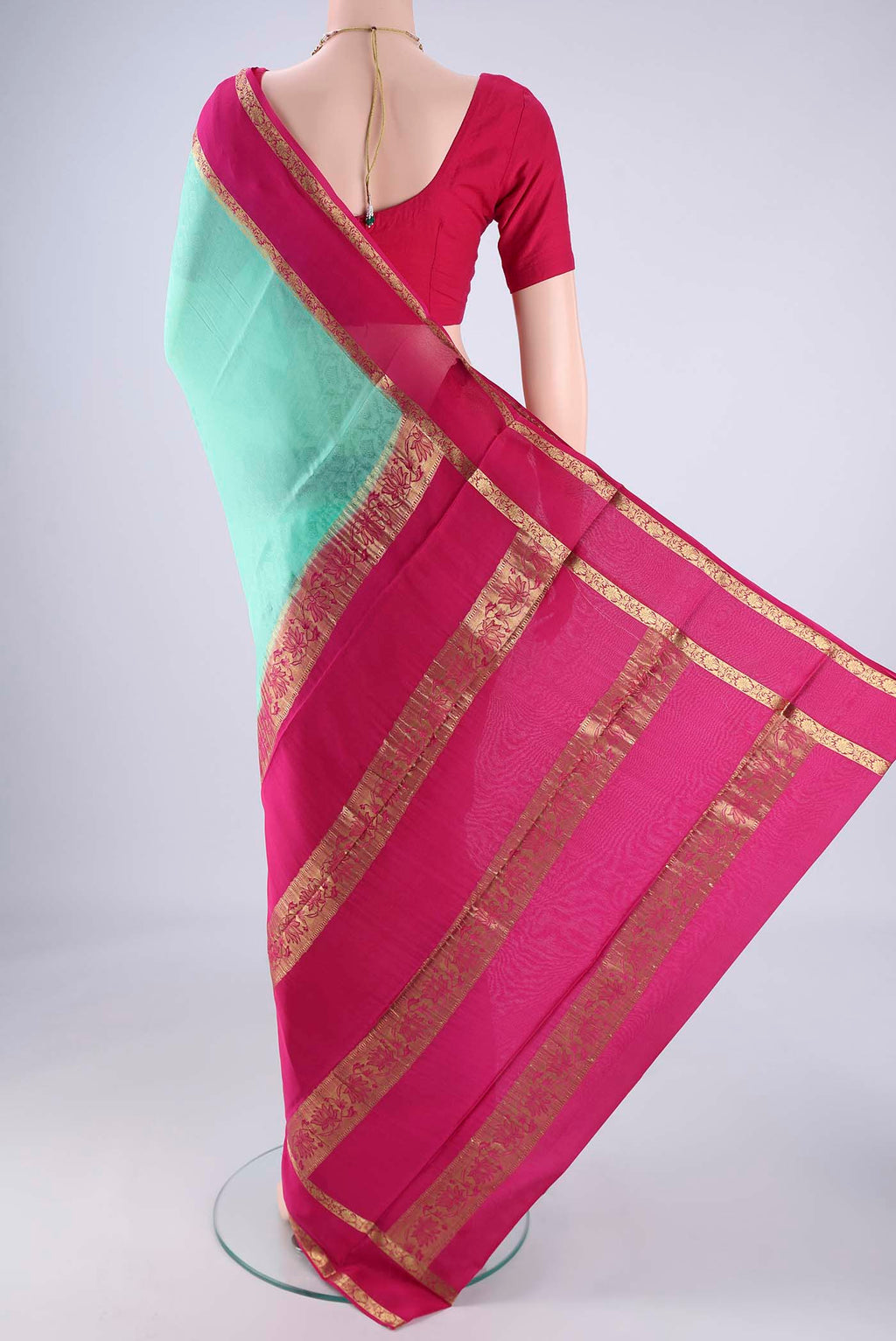 Flat view of Turquoise Mysore Crepe Saree with Jacquard design on the body and Zari Border. 
