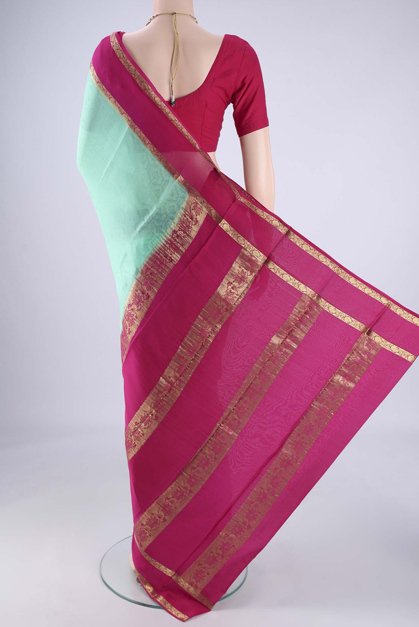 Flat view of Turquoise Mysore Crepe Saree with Jacquard design on the body and Zari Border. 