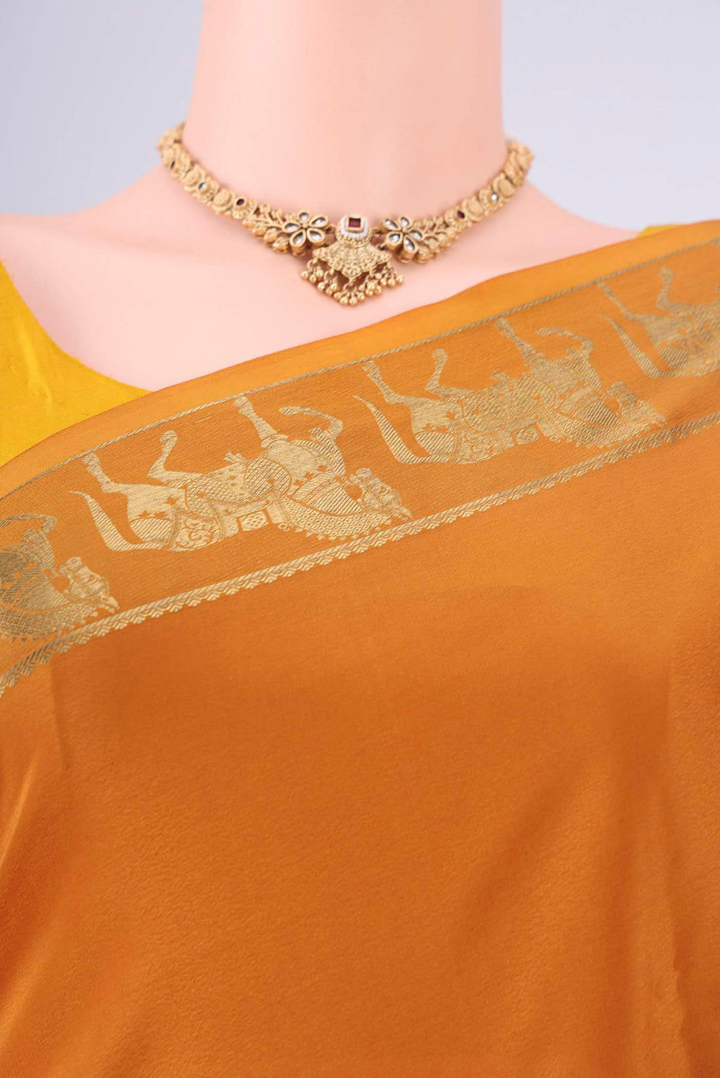 Border image of Mustard Mysore Crepe Saree with Plain Body and Zari Border. 