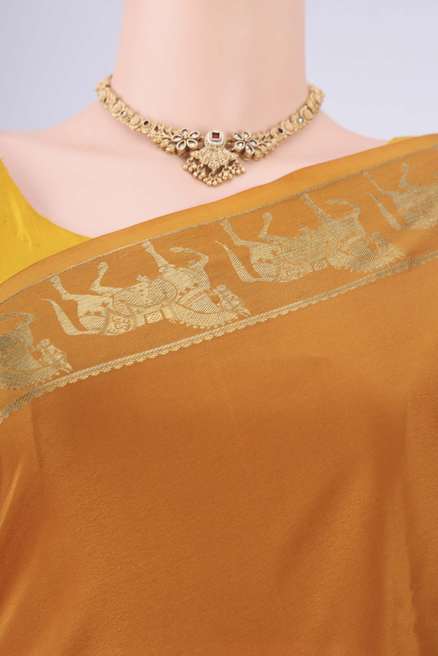 Border image of Mustard Mysore Crepe Saree with Plain Body and Zari Border. 