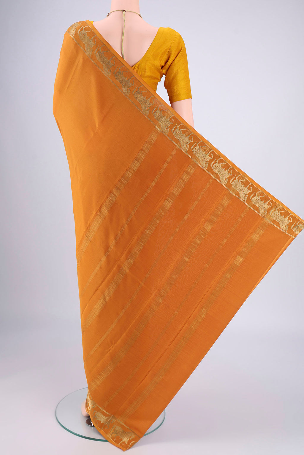 Flat view of Mustard Mysore Crepe Saree with Plain Body and Zari Border. 