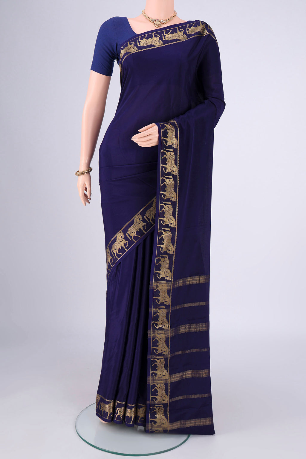 Navy Blue Mysore Crepe Saree with Plain Body and Zari Border.  displayed on a mannequin