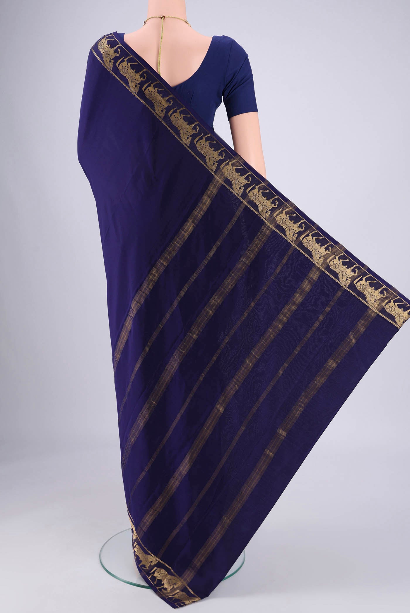 Flat view of Navy Blue Mysore Crepe Saree with Plain Body and Zari Border. 