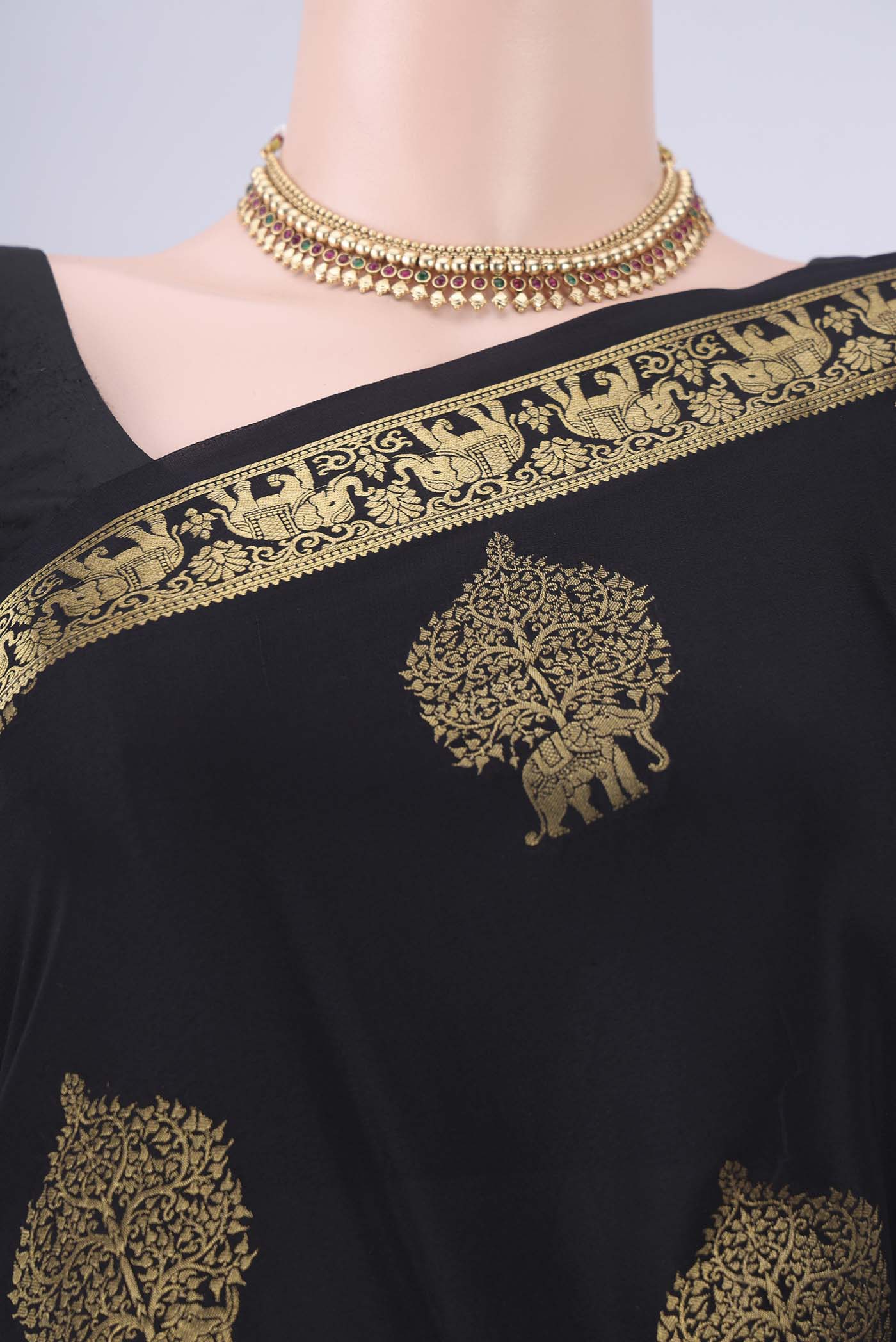 Border image of Black Mysore Crepe Saree with Zari Butta on the body and Zari Border. 