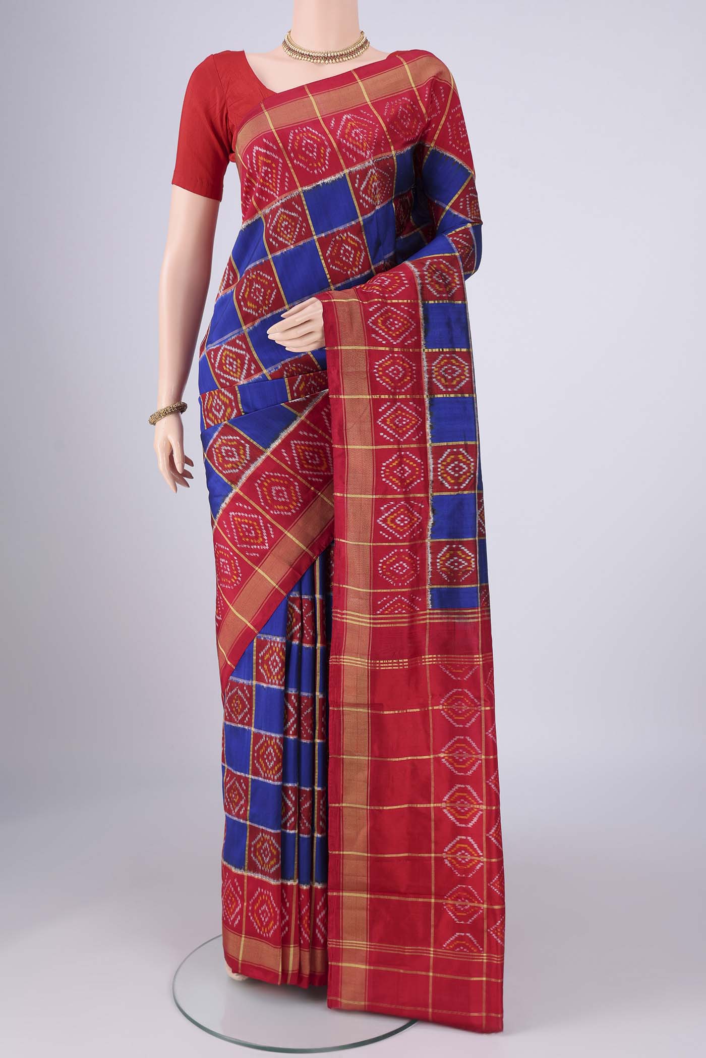 Multi Color Pochampally Silk Saree with Pure Ikat on the body and Zari Border.  displayed on a mannequin