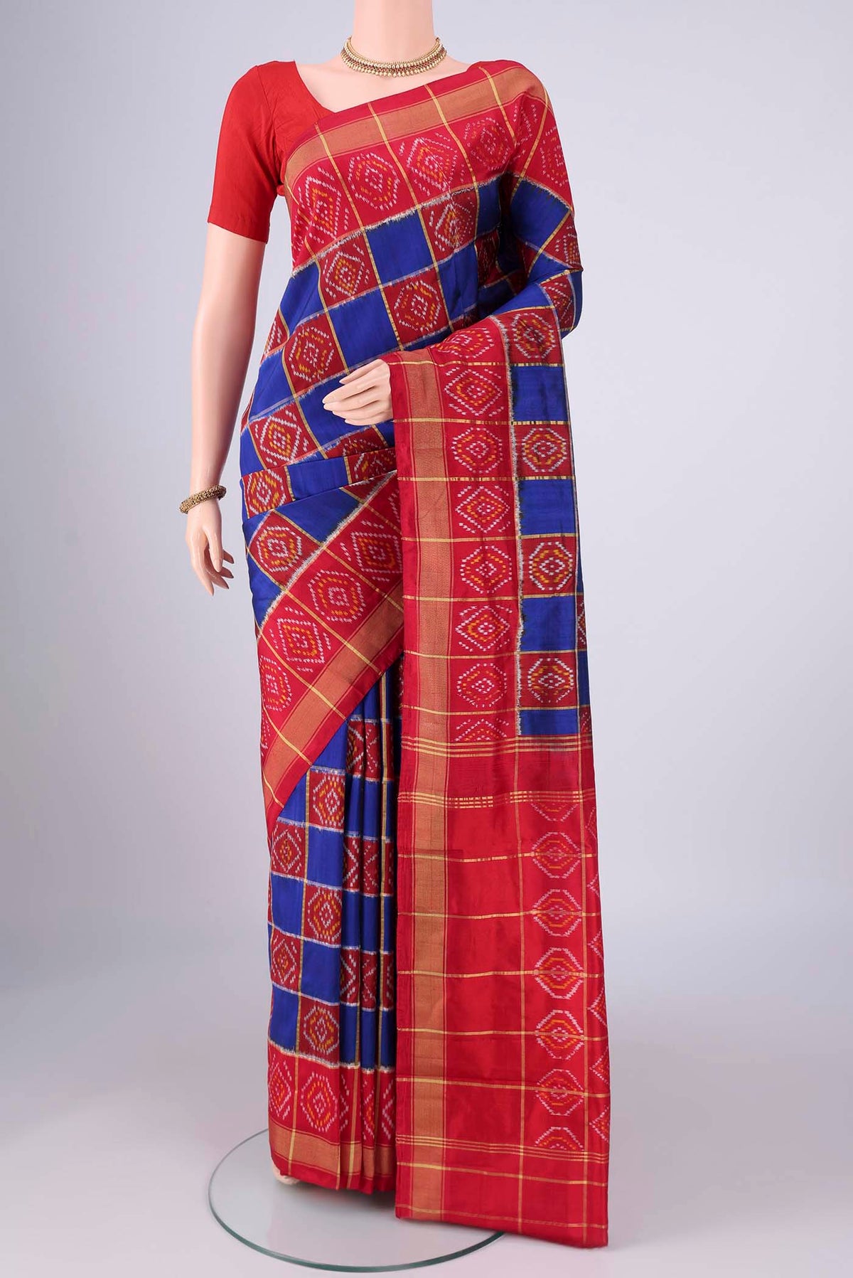 Multi Color Pochampally Silk Saree with Pure Ikat on the body and Zari Border.  displayed on a mannequin