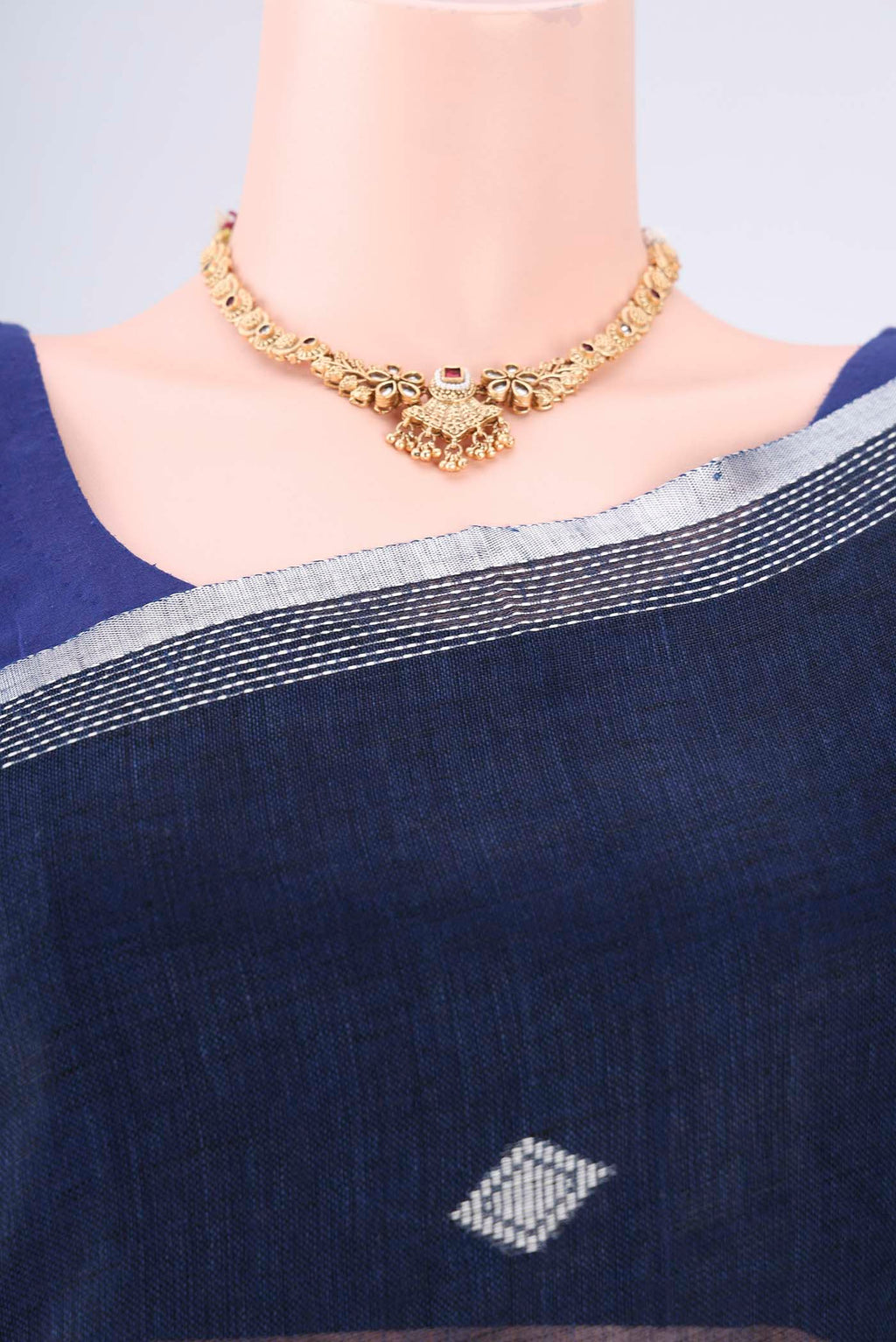 Border image of Navy Blue Linen Cotton Saree with Thread Butta on the body and Zari Border. 