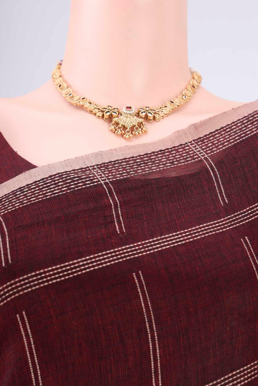 Border image of Maroon Linen Cotton Saree with Stripes on the body and Plain Border. 