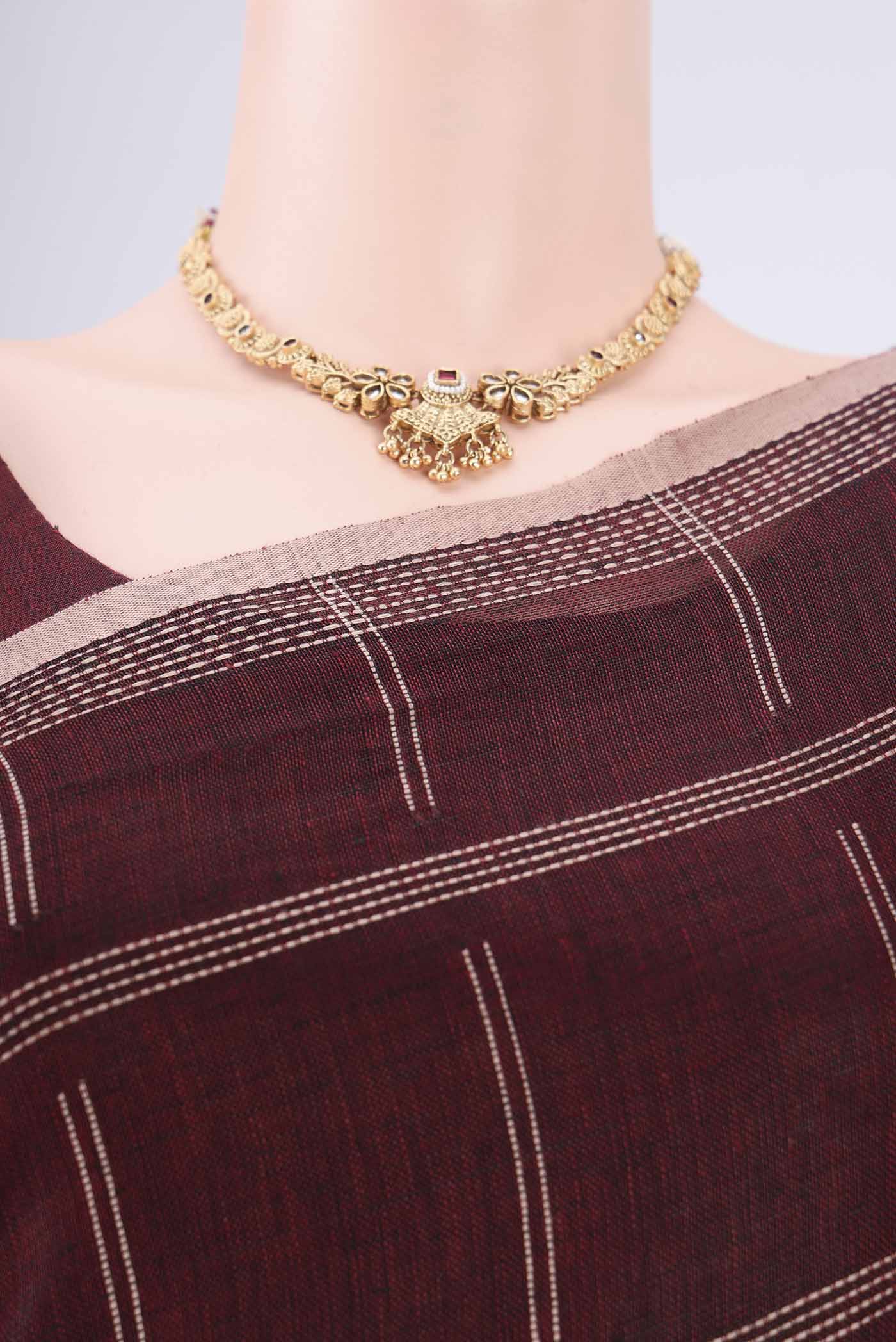 Border image of Maroon Linen Cotton Saree with Stripes on the body and Plain Border. 
