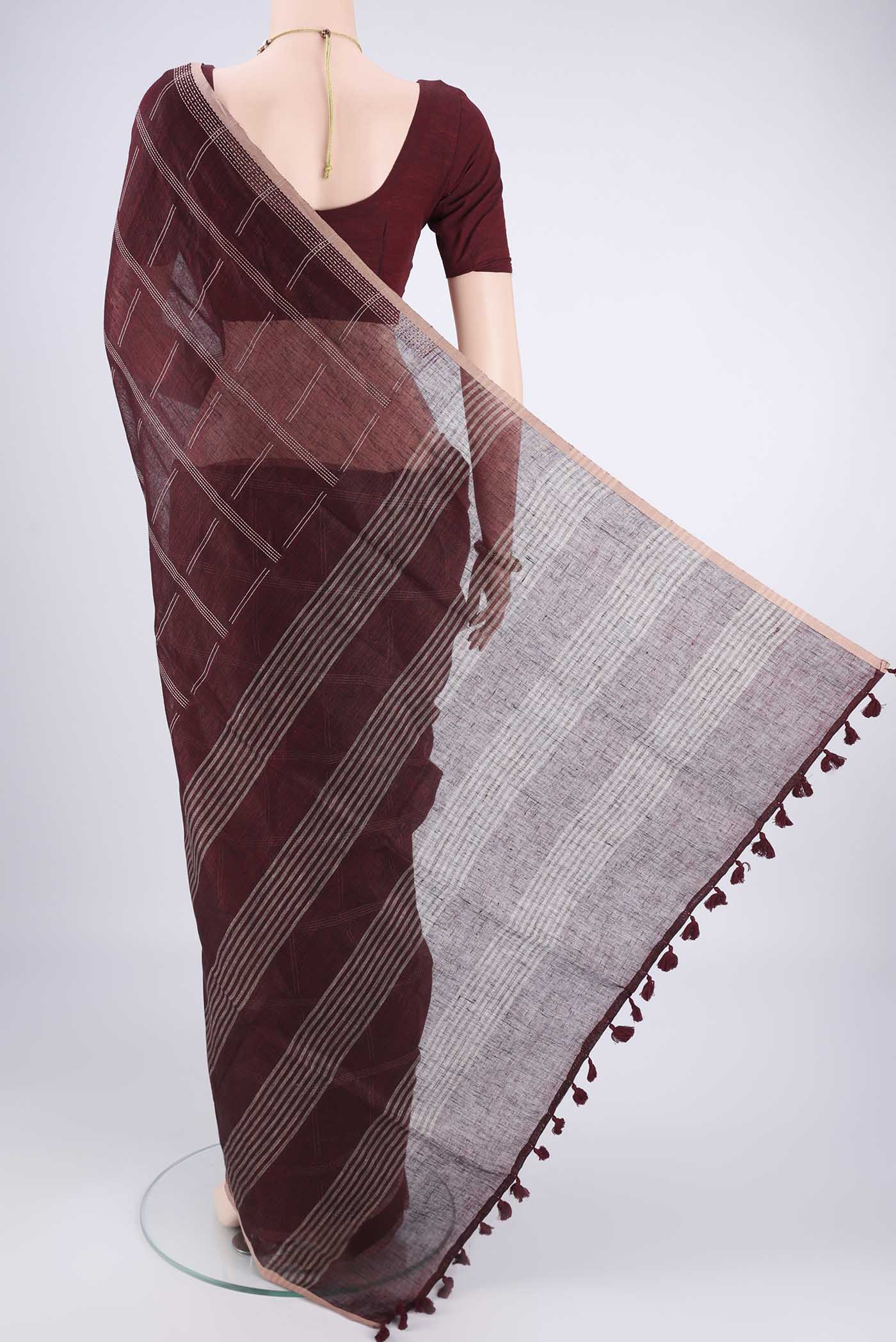 Flat view of Maroon Linen Cotton Saree with Stripes on the body and Plain Border. 