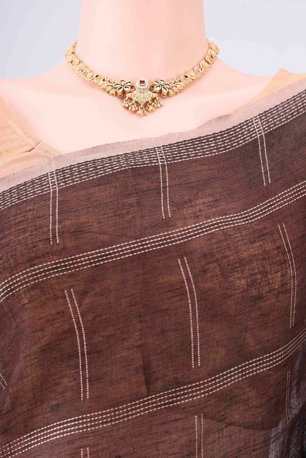 Border image of Brown Linen Cotton Saree with Stripes on the body and Plain Border. 
