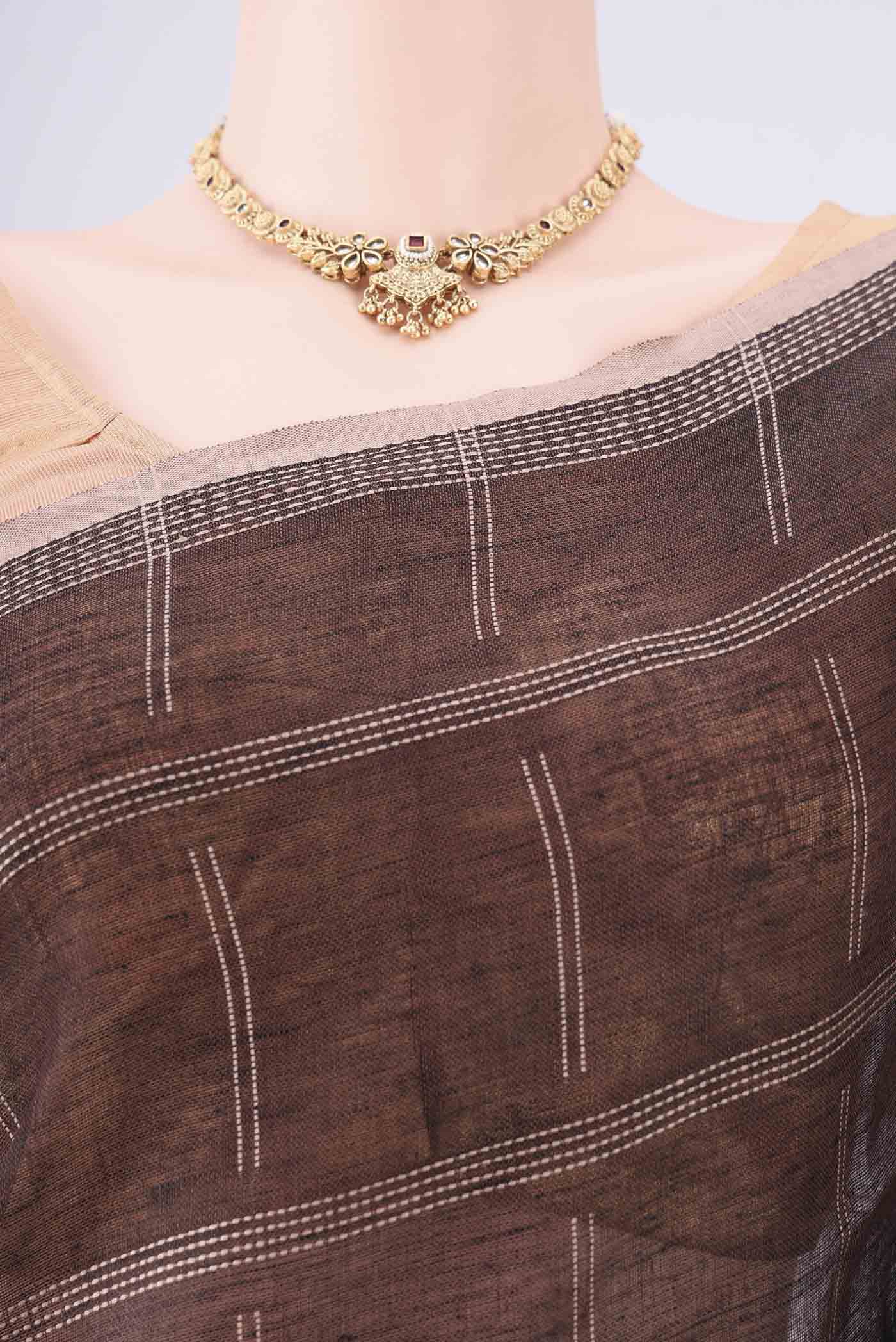 Border image of Brown Linen Cotton Saree with Stripes on the body and Plain Border. 