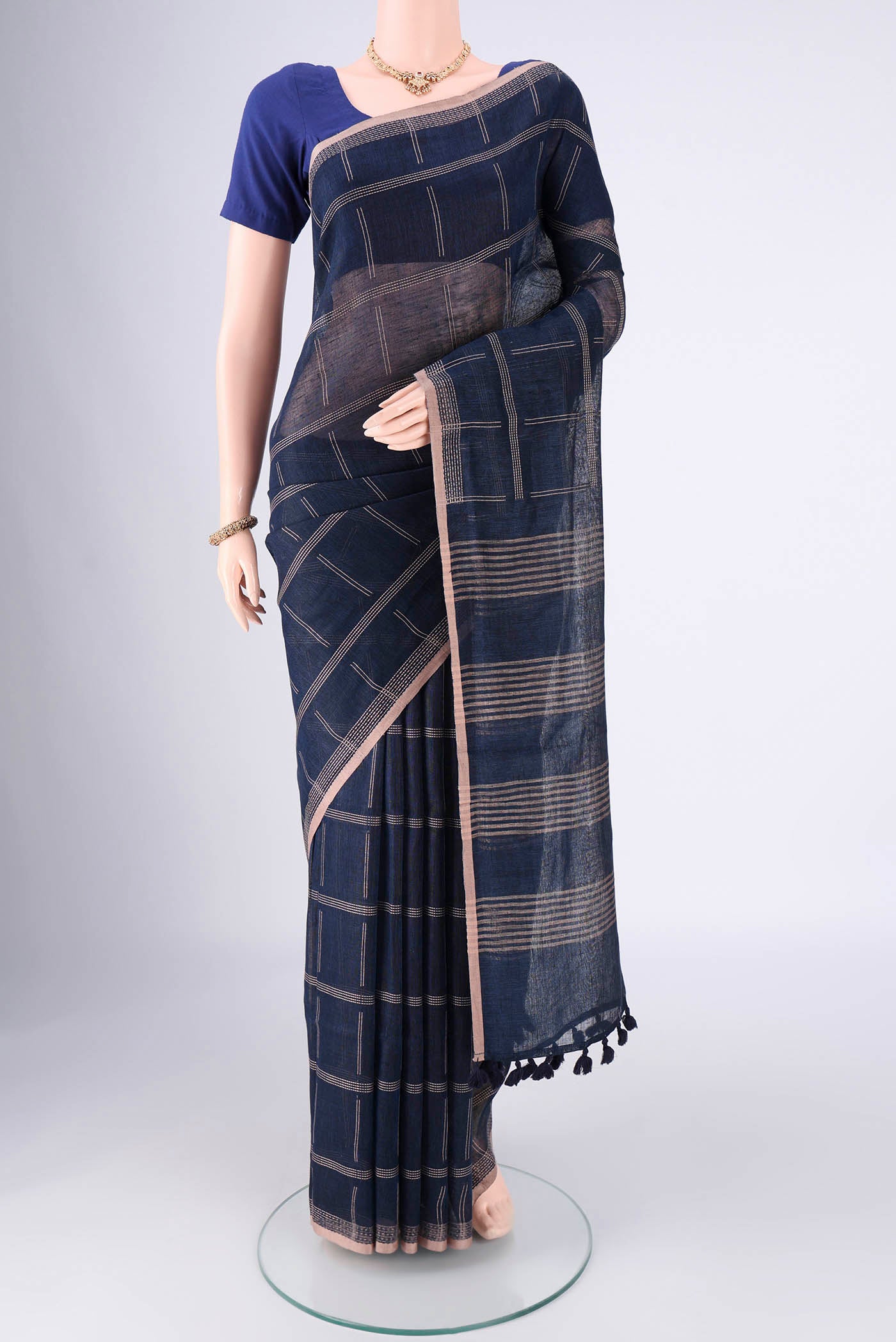 Navy Blue Linen Cotton Saree with Stripes on the body and Plain Border.  displayed on a mannequin
