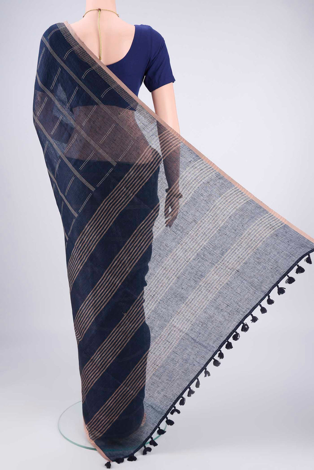 Flat view of Navy Blue Linen Cotton Saree with Stripes on the body and Plain Border. 
