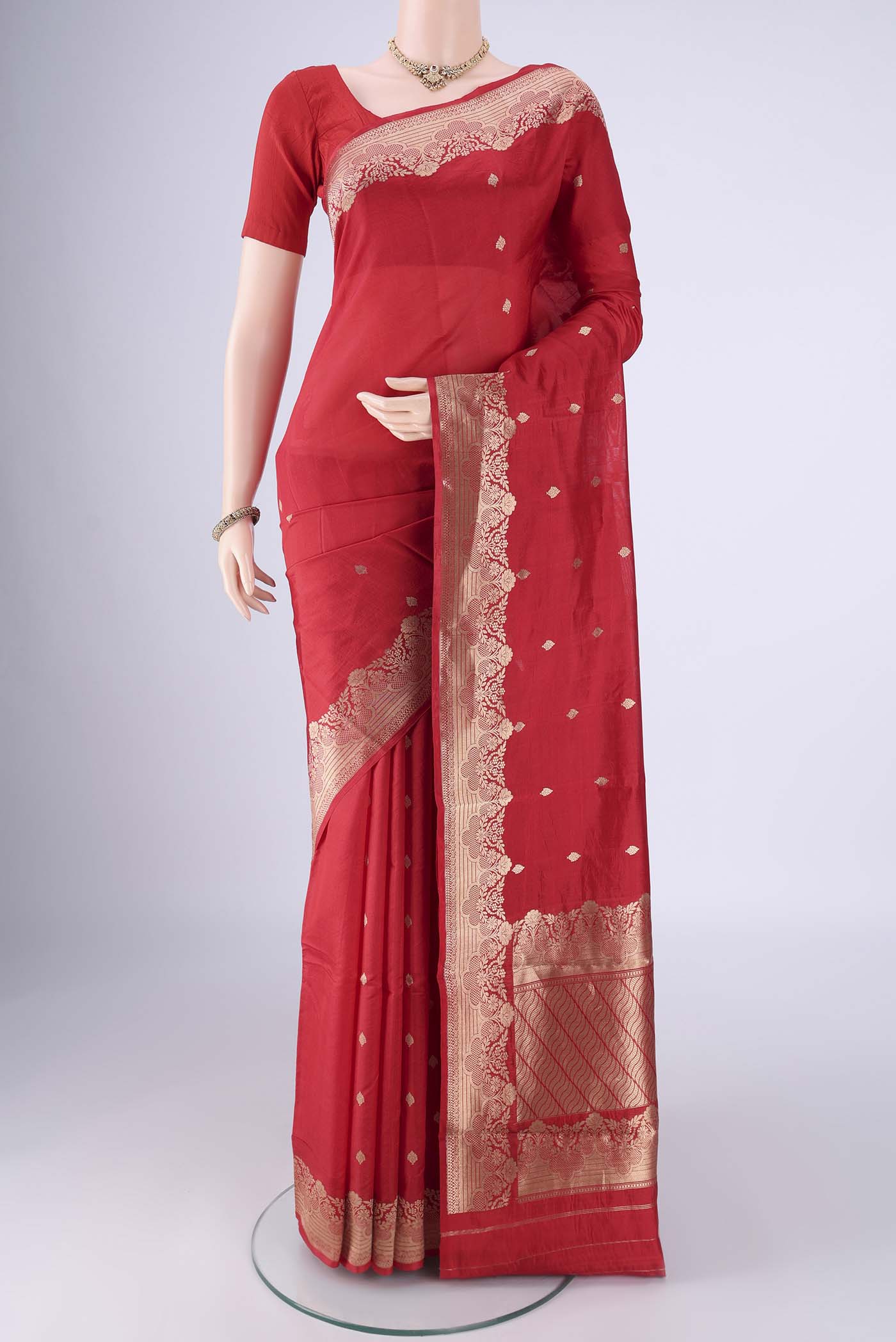 Red Banarasi Katan Silk Saree with Zari Butta on the body and Zari Border.  displayed on a mannequin