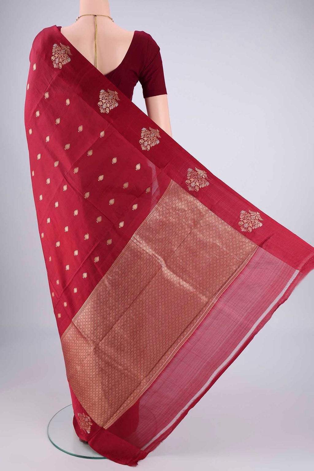 Flat view of Maroon Banarasi Katan Silk Saree with Zari Butta on the body and Satin Border. 