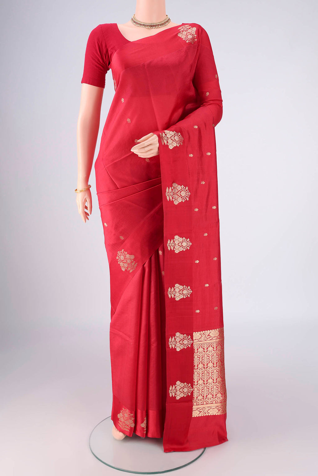 Red Banarasi Katan Silk Saree with Zari Butta on the body and Plain Border.  displayed on a mannequin