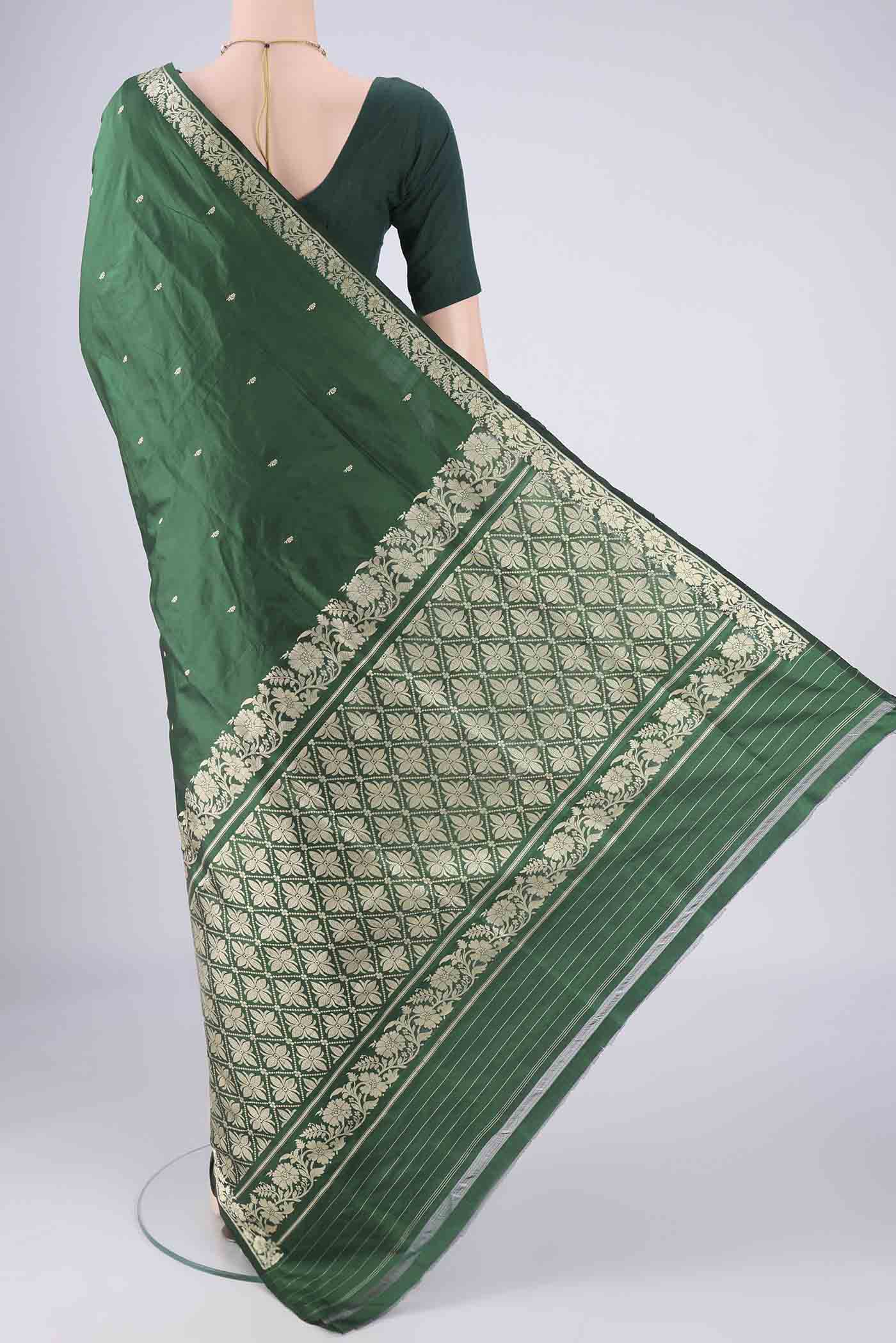 Flat view of Bottle Green Banarasi Silk Saree with Thread Butta on the body and Thread Border. 