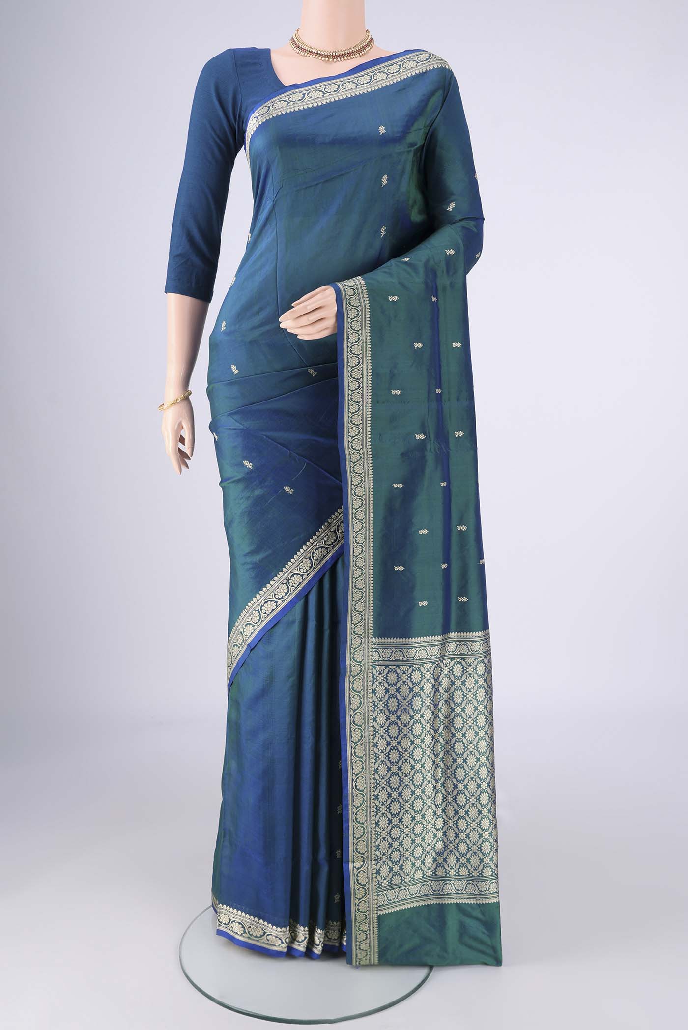 Peacock Blue Dual Tone Banarasi Silk Saree with Thread Butta on the body and Thread Border.  displayed on a mannequin