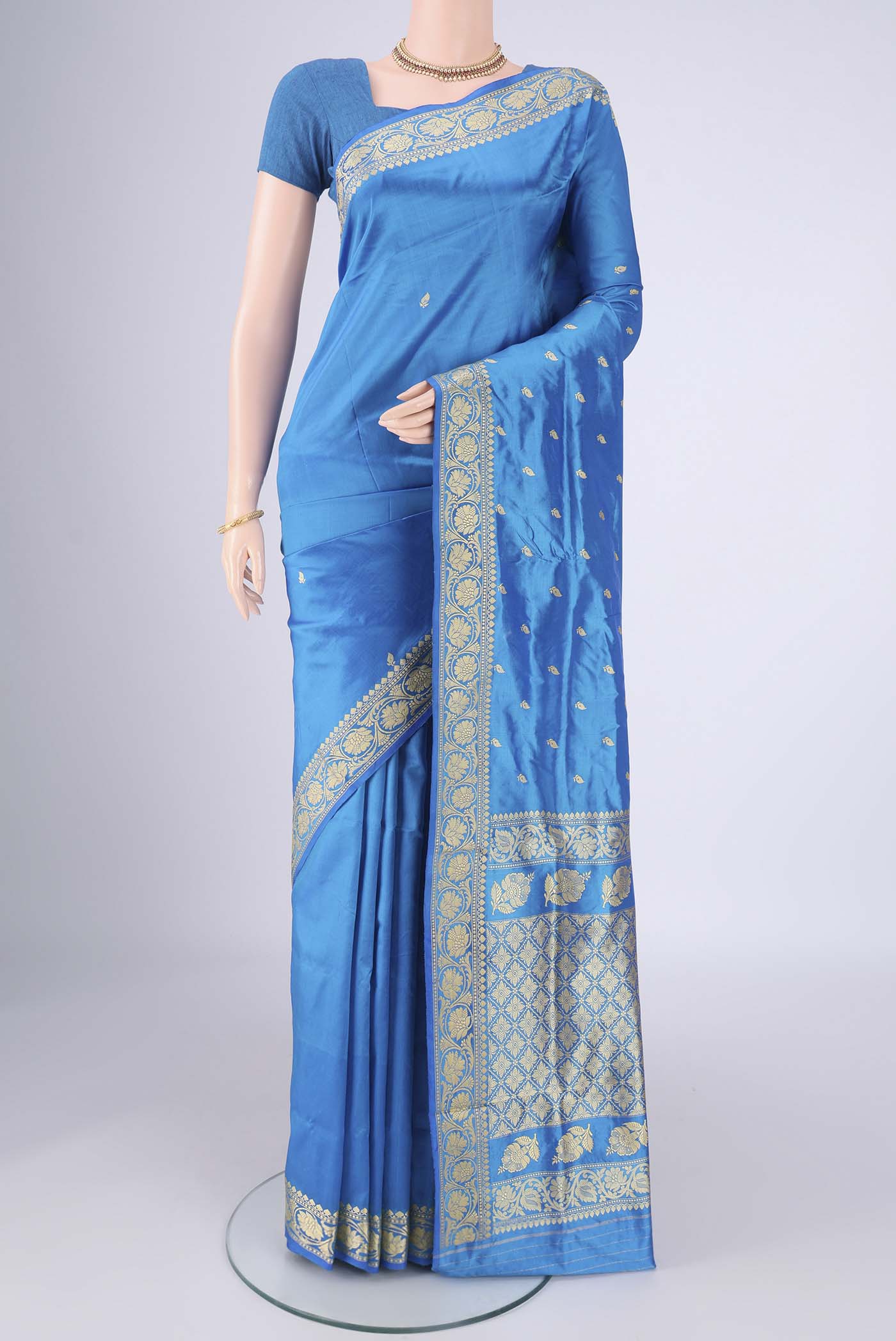 Electric Blue Banarasi Silk Saree with Thread Butta on the body and Thread Border.  displayed on a mannequin