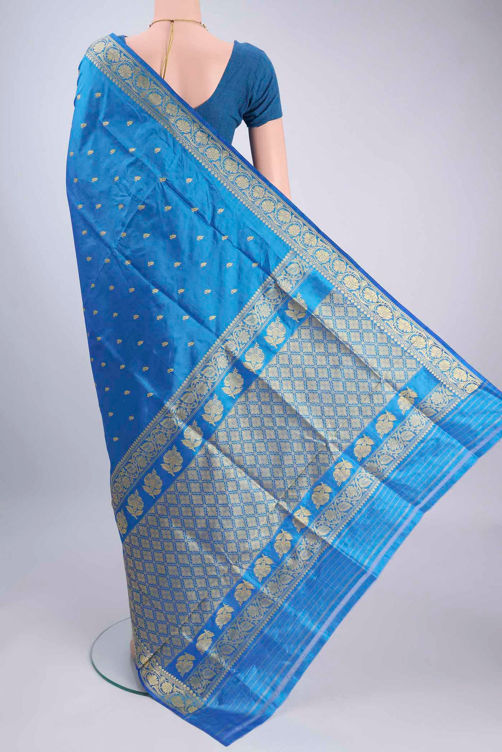 Flat view of Electric Blue Banarasi Silk Saree with Thread Butta on the body and Thread Border. 