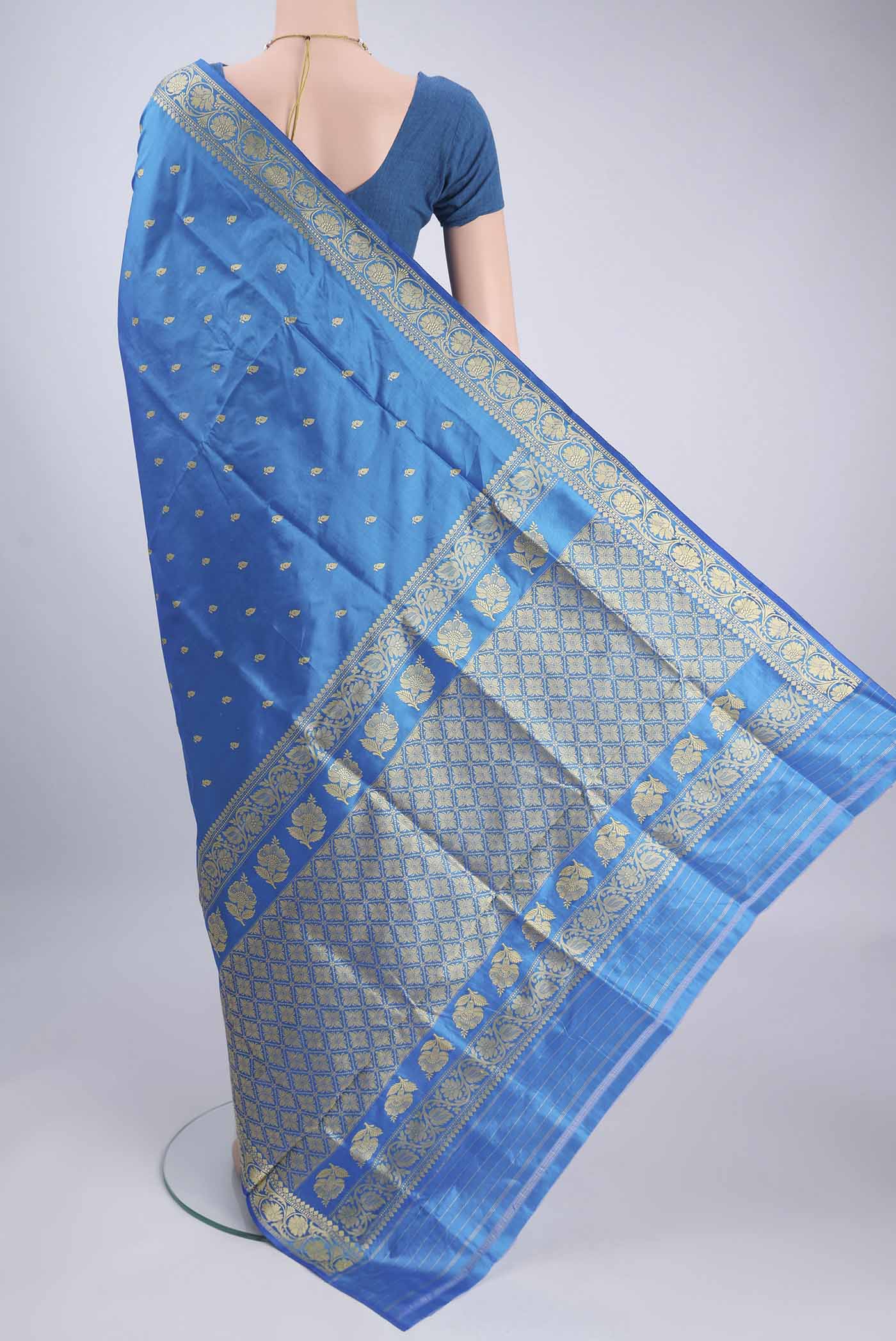 Flat view of Electric Blue Banarasi Silk Saree with Thread Butta on the body and Thread Border. 