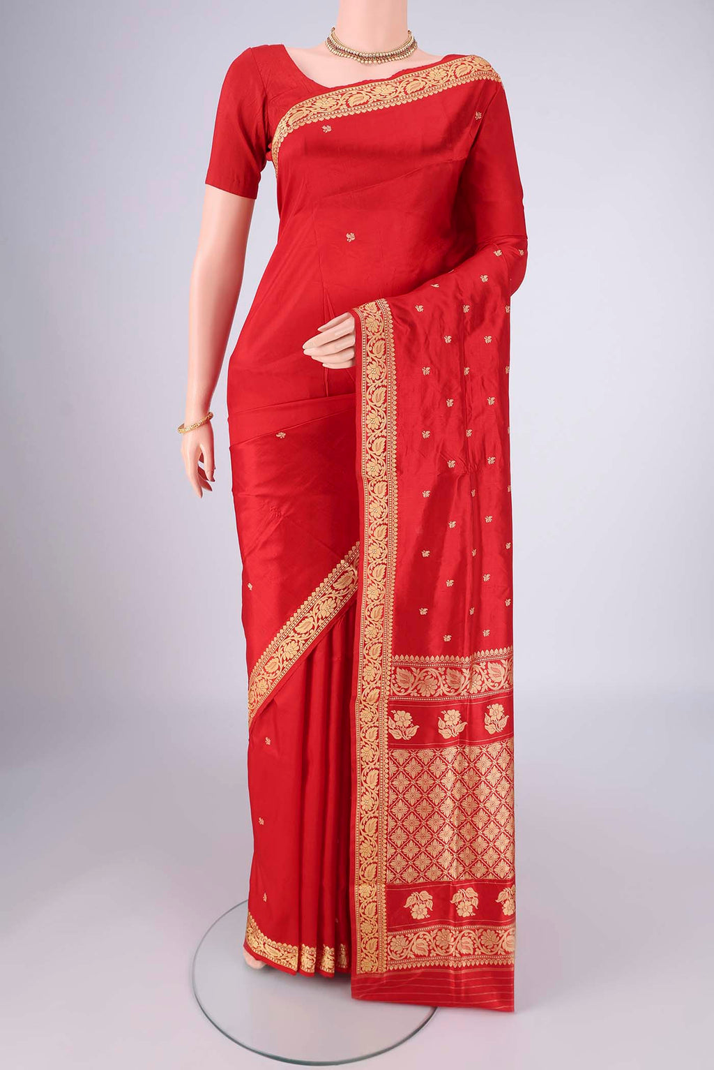 Red Banarasi Silk Saree with Thread Butta on the body and Thread Border.  displayed on a mannequin