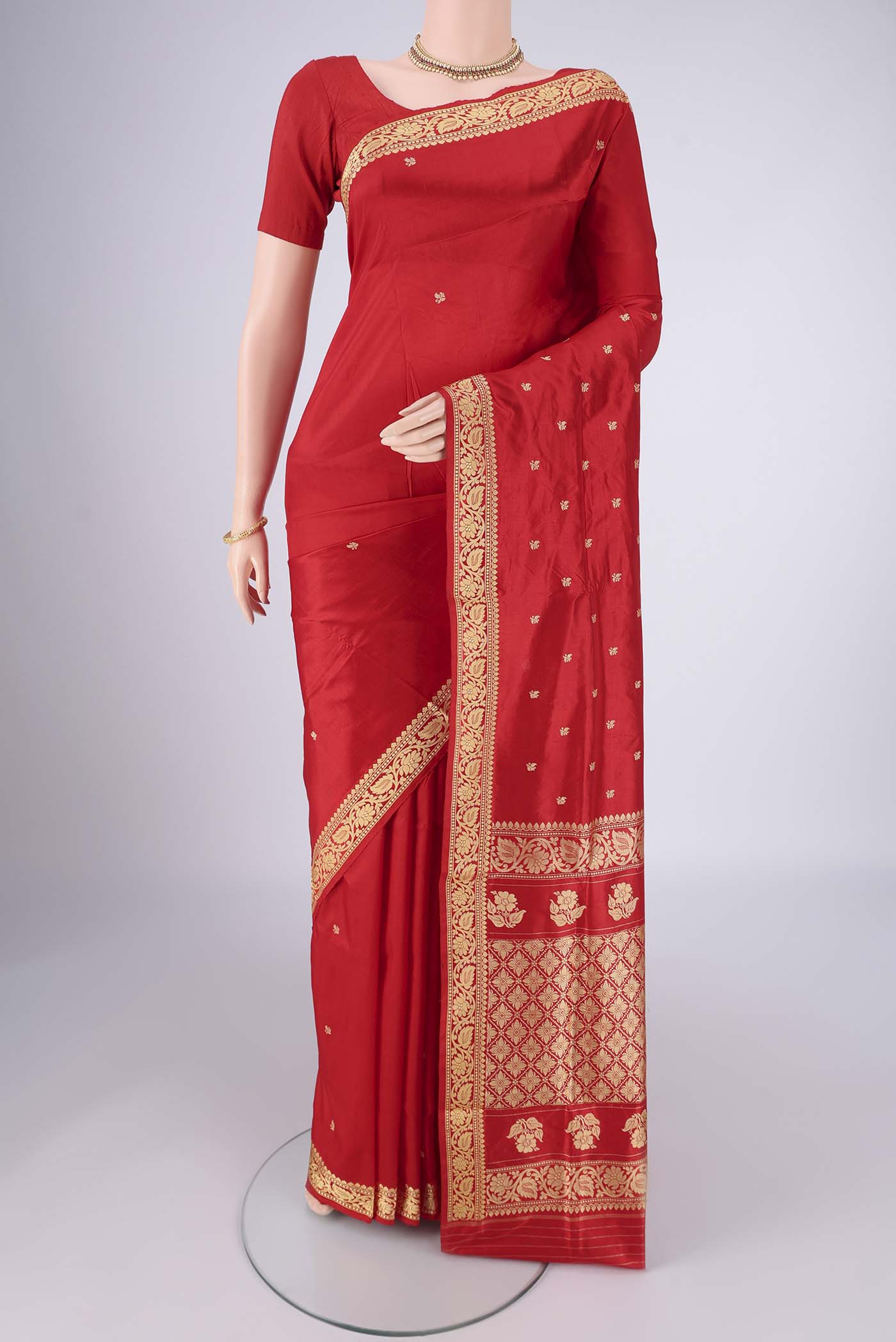 Red Banarasi Silk Saree with Thread Butta on the body and Thread Border.  displayed on a mannequin