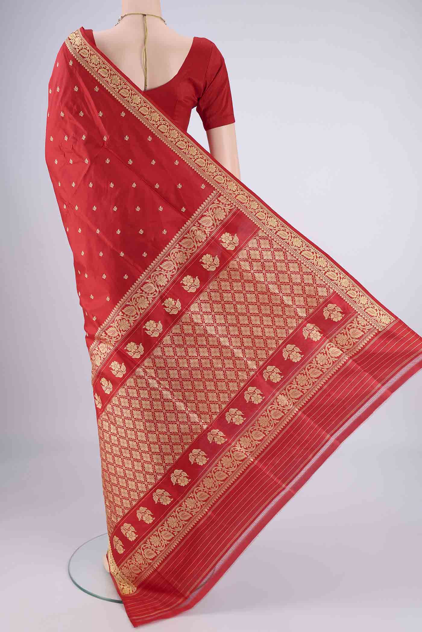 Flat view of Red Banarasi Silk Saree with Thread Butta on the body and Thread Border. 