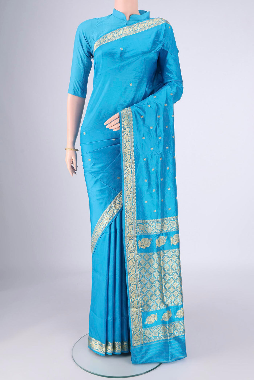 Electric Blue Banarasi Silk Saree with Thread Butta on the body and Thread Border.  displayed on a mannequin