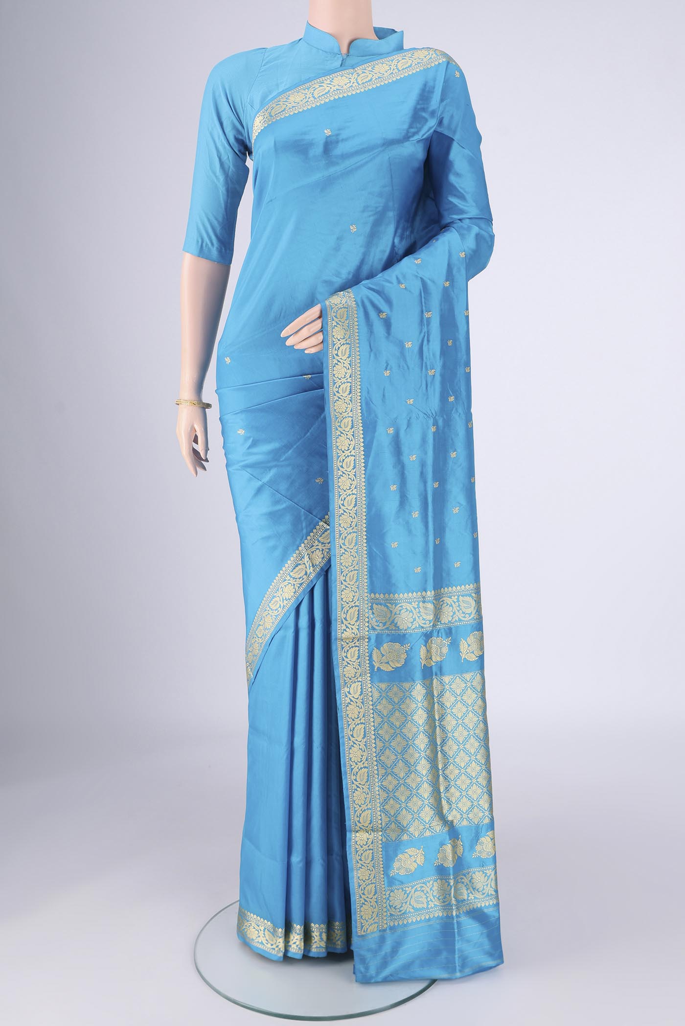 Electric Blue Banarasi Silk Saree with Thread Butta on the body and Thread Border.  displayed on a mannequin