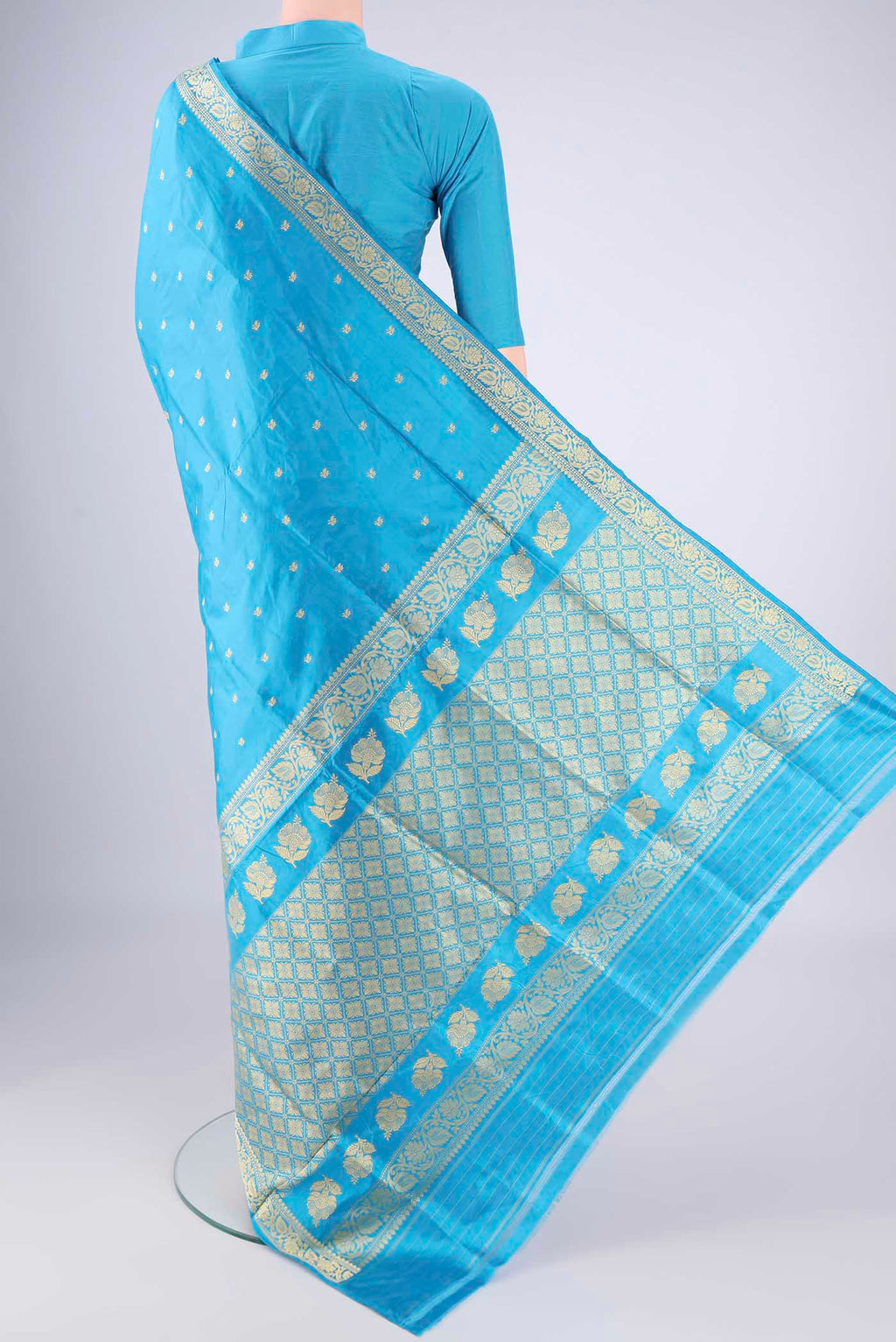 Flat view of Electric Blue Banarasi Silk Saree with Thread Butta on the body and Thread Border. 