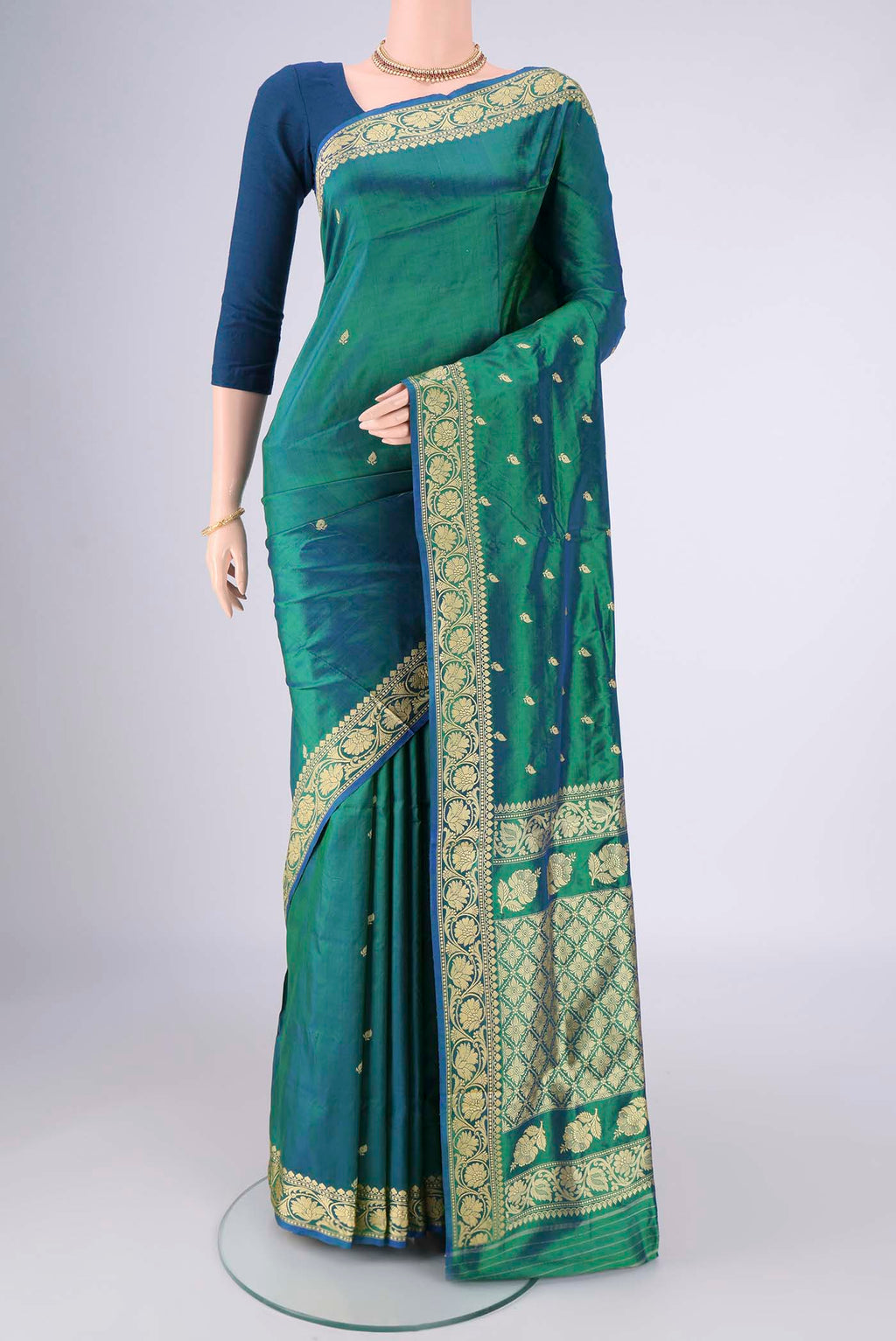 Peacock Blue Dual Tone Banarasi Silk Saree with Thread Butta on the body and Thread Border.  displayed on a mannequin