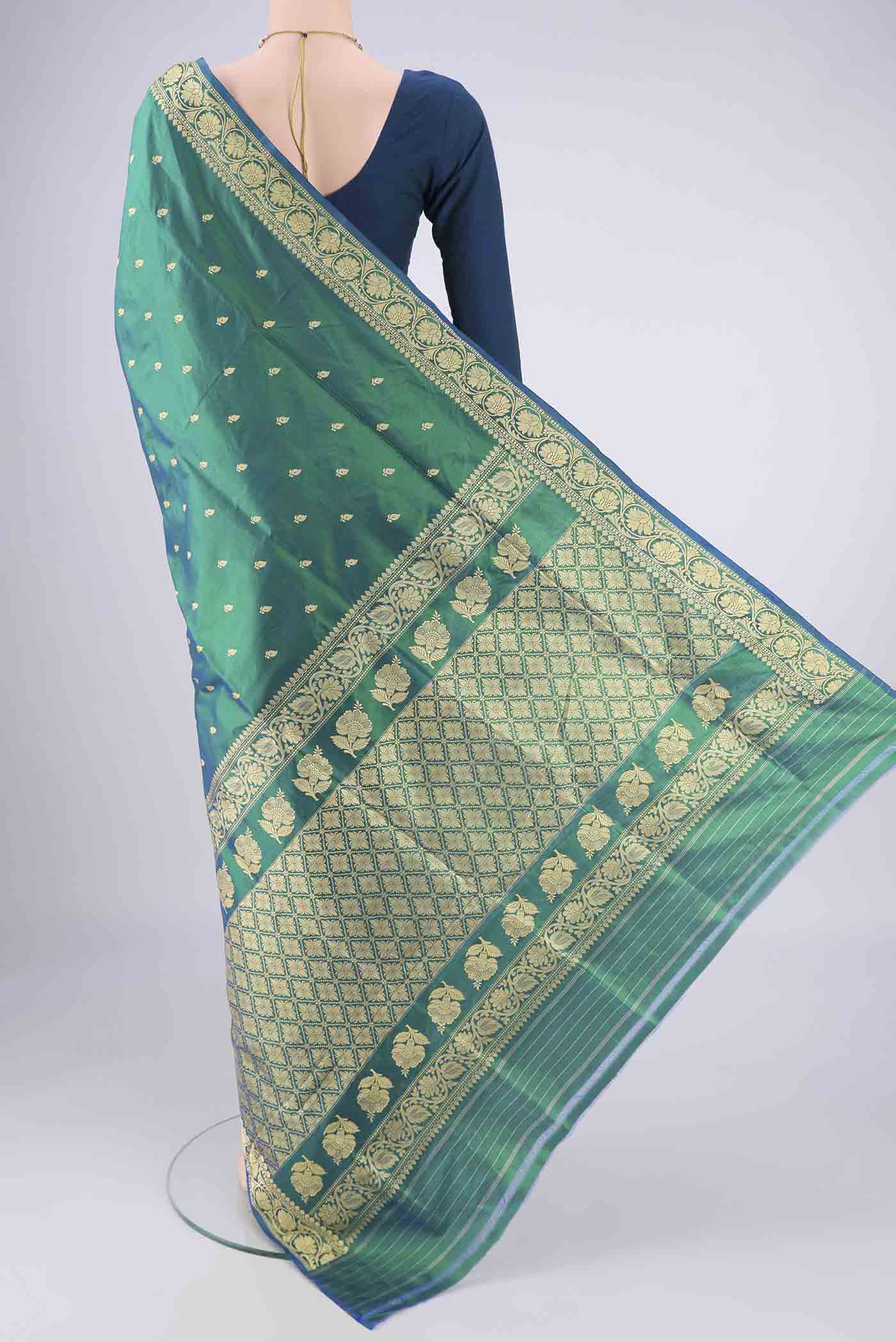 Flat view of Peacock Blue Dual Tone Banarasi Silk Saree with Thread Butta on the body and Thread Border. 