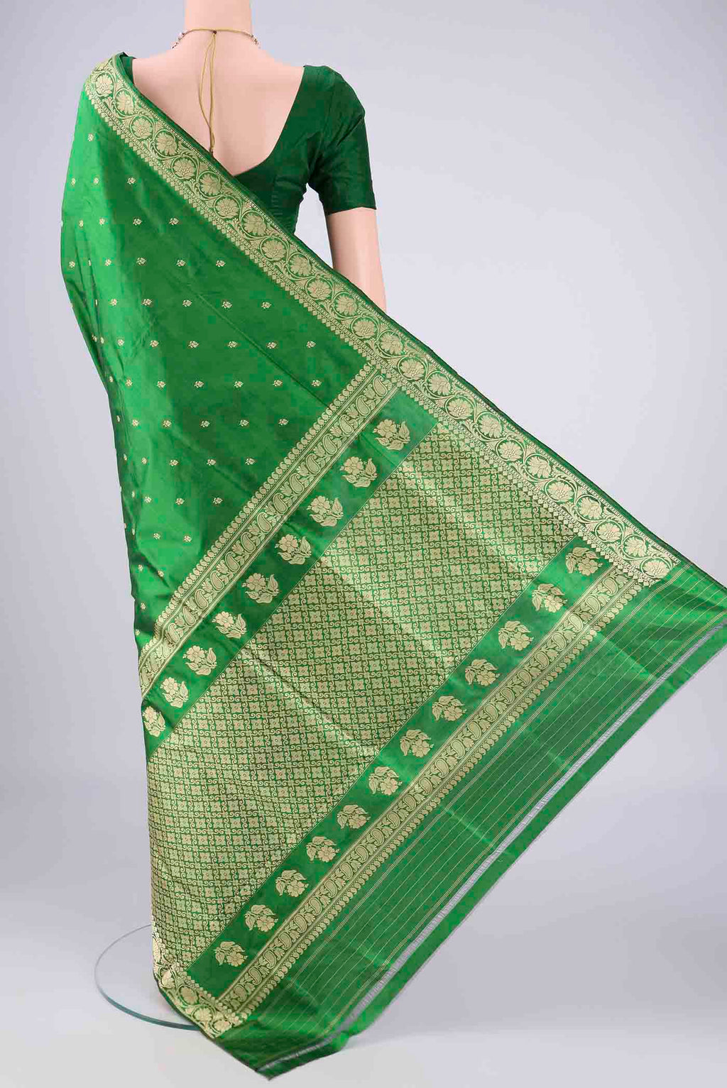 Flat view of Green Banarasi Silk Saree with Thread Butta on the body and Thread Border. 