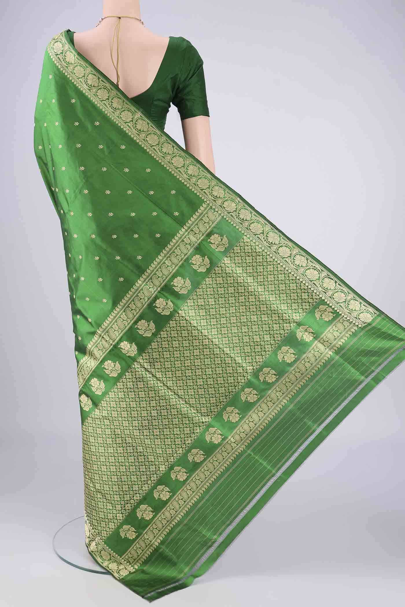 Flat view of Green Banarasi Silk Saree with Thread Butta on the body and Thread Border. 