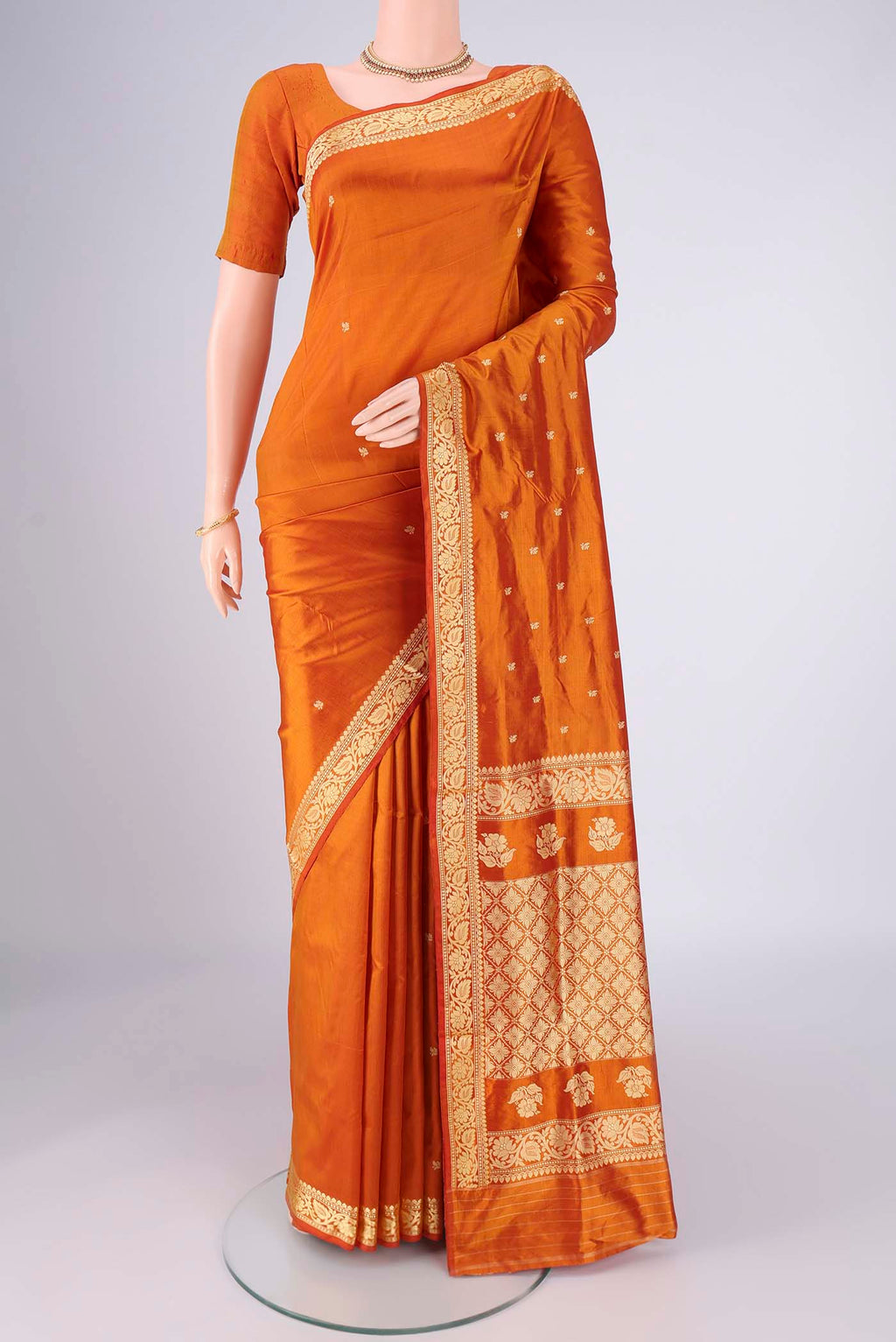 Mustard Dual Tone Banarasi Silk Saree with Thread Butta on the body and Thread Border.  displayed on a mannequin