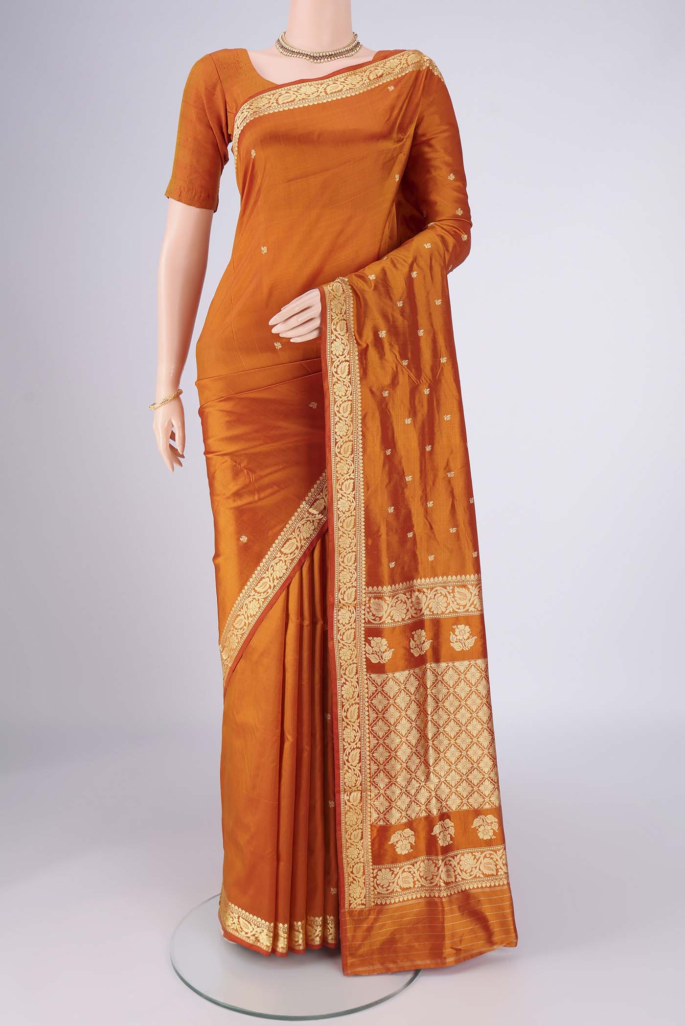 Mustard Dual Tone Banarasi Silk Saree with Thread Butta on the body and Thread Border.  displayed on a mannequin