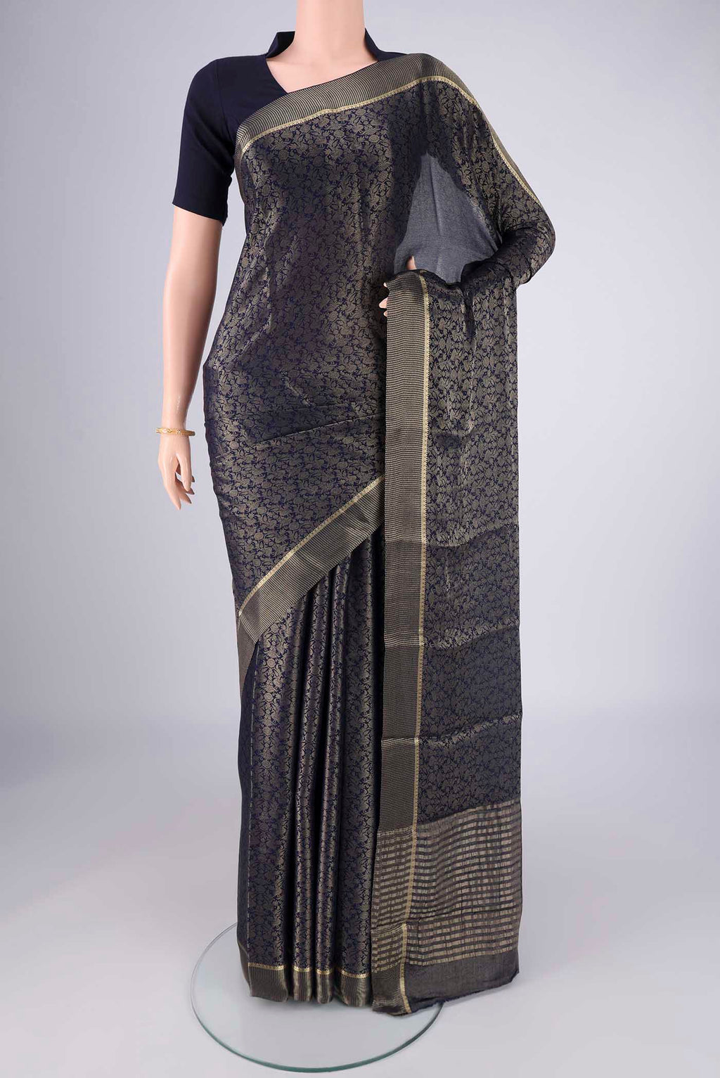 Navy Blue Mysore Crepe Saree with Zari Brocade on the body and Zari Border.  displayed on a mannequin