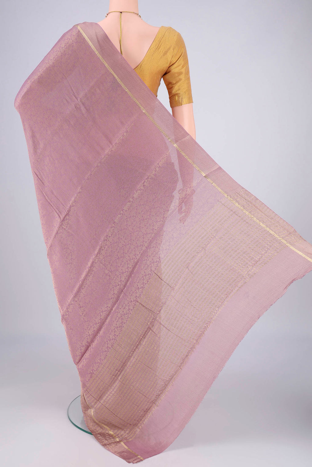 Flat view of Lavender Mysore Crepe Saree with Zari Brocade on the body and Zari Border. 