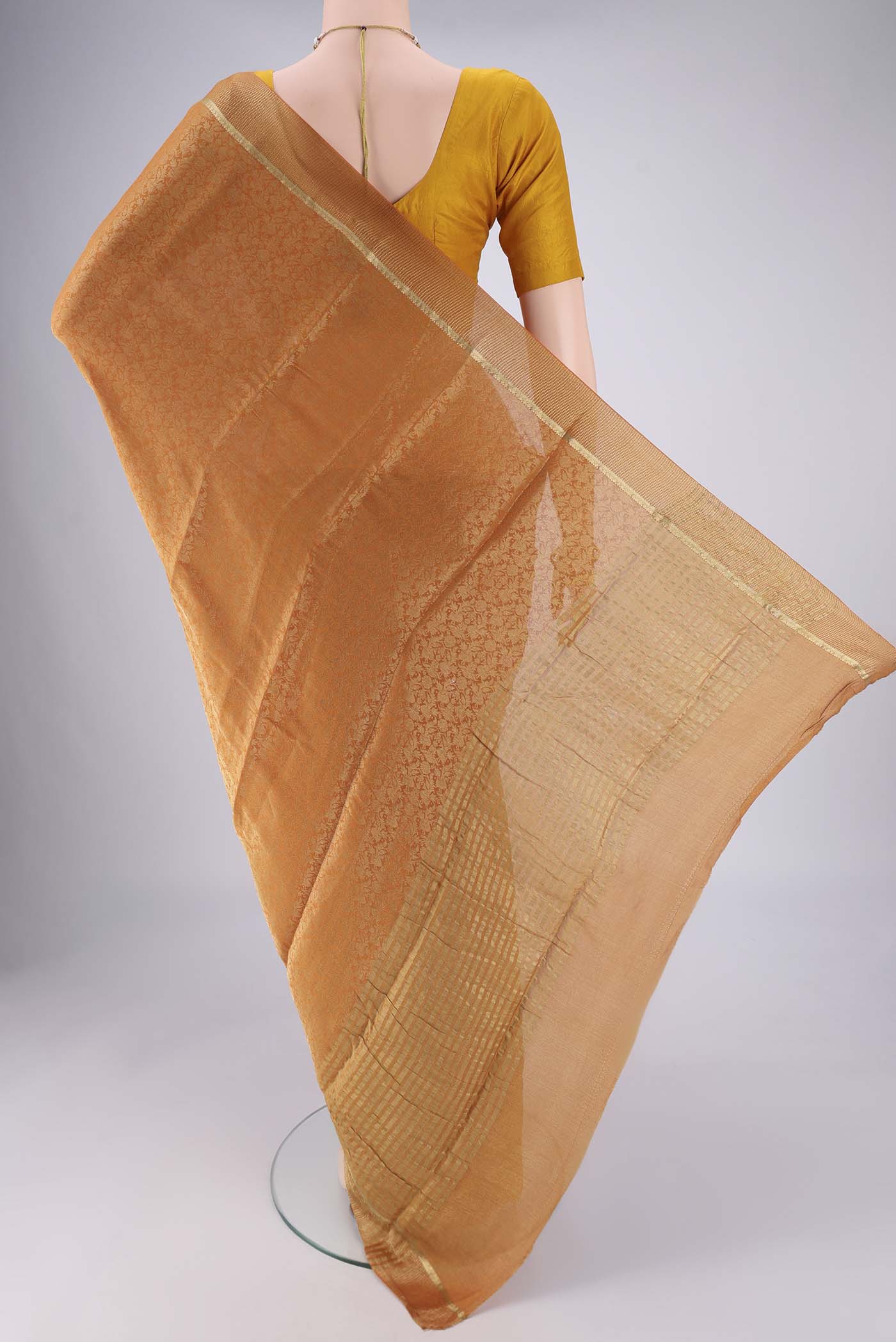 Flat view of Mustard Mysore Crepe Saree with Zari Brocade on the body and Zari Border. 
