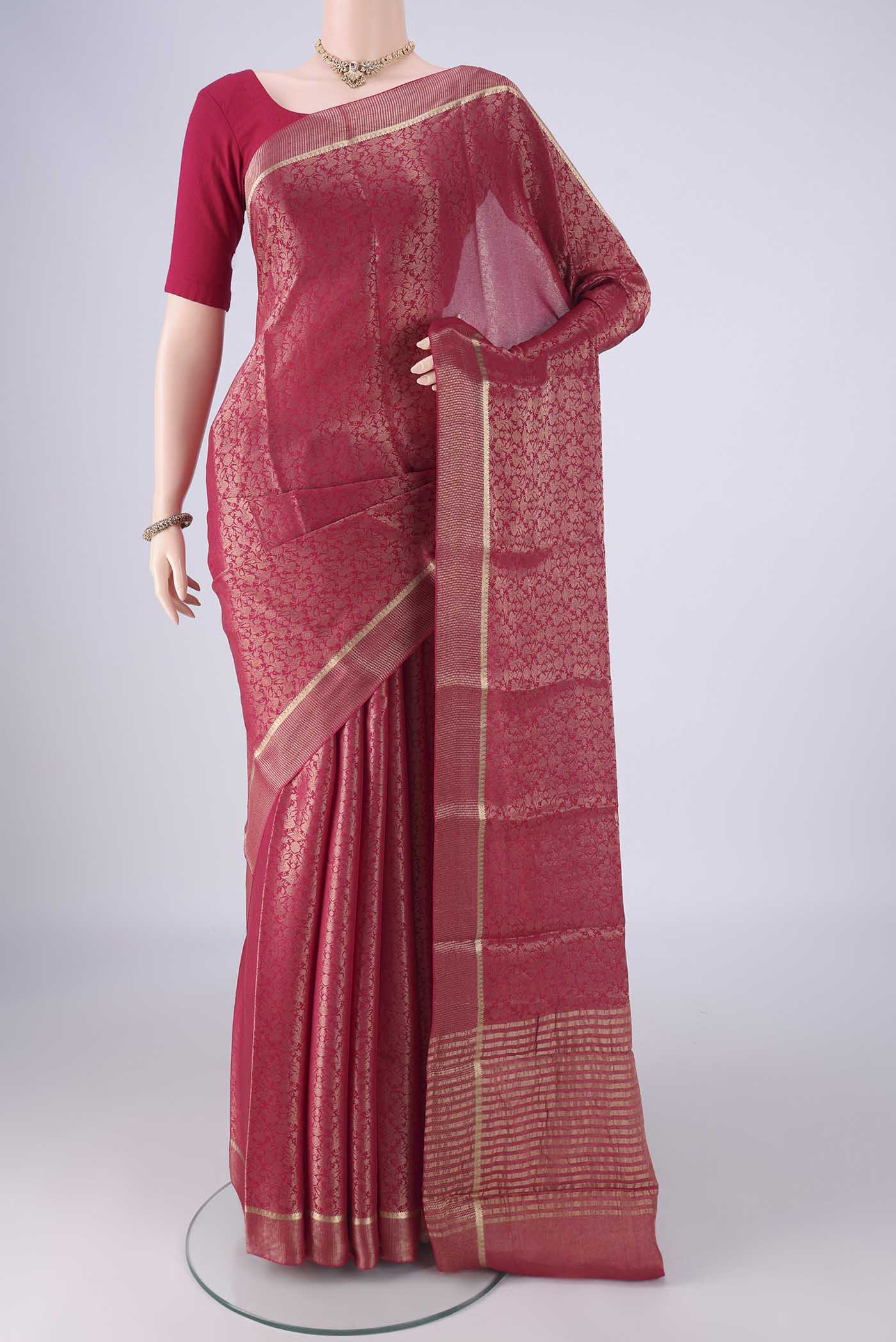 Dark Pink Mysore Crepe Saree with Zari Brocade on the body and Zari Border.  displayed on a mannequin