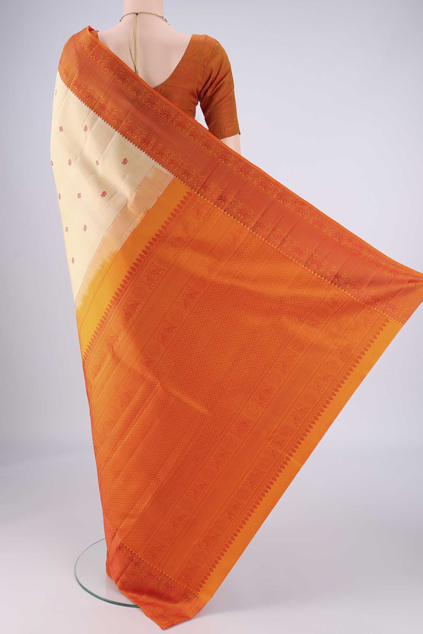 Flat view of Beige Kanchipuram Silk Saree with Thread Butta on the body and Thread Border. 