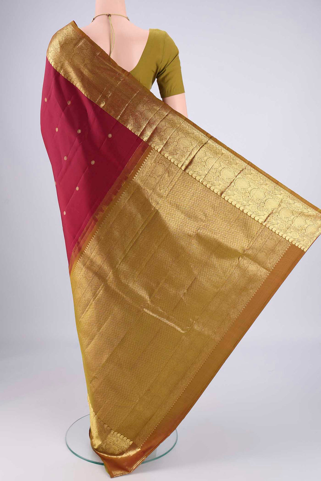 Flat view of Pure Silk Pure Zari Maroon Kanchipuram Saree with Zari Butta on the body and Zari Border. 