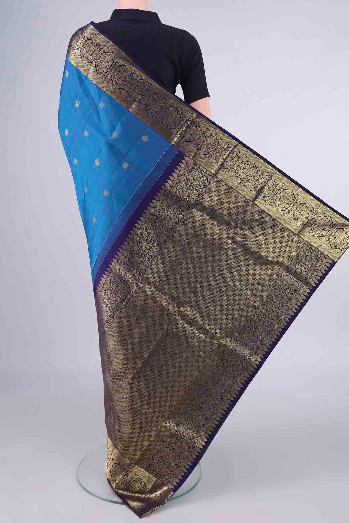Flat view of Pure Silk Blue Kanchipuram Saree with Zari Butta on the body and Zari Border. 