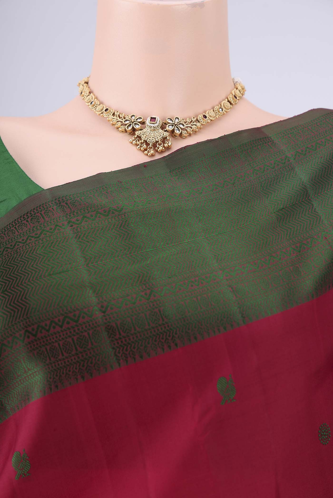 Border image of Maroon Kanchipuram Silk Saree with Thread Butta on the body and Thread Border. 