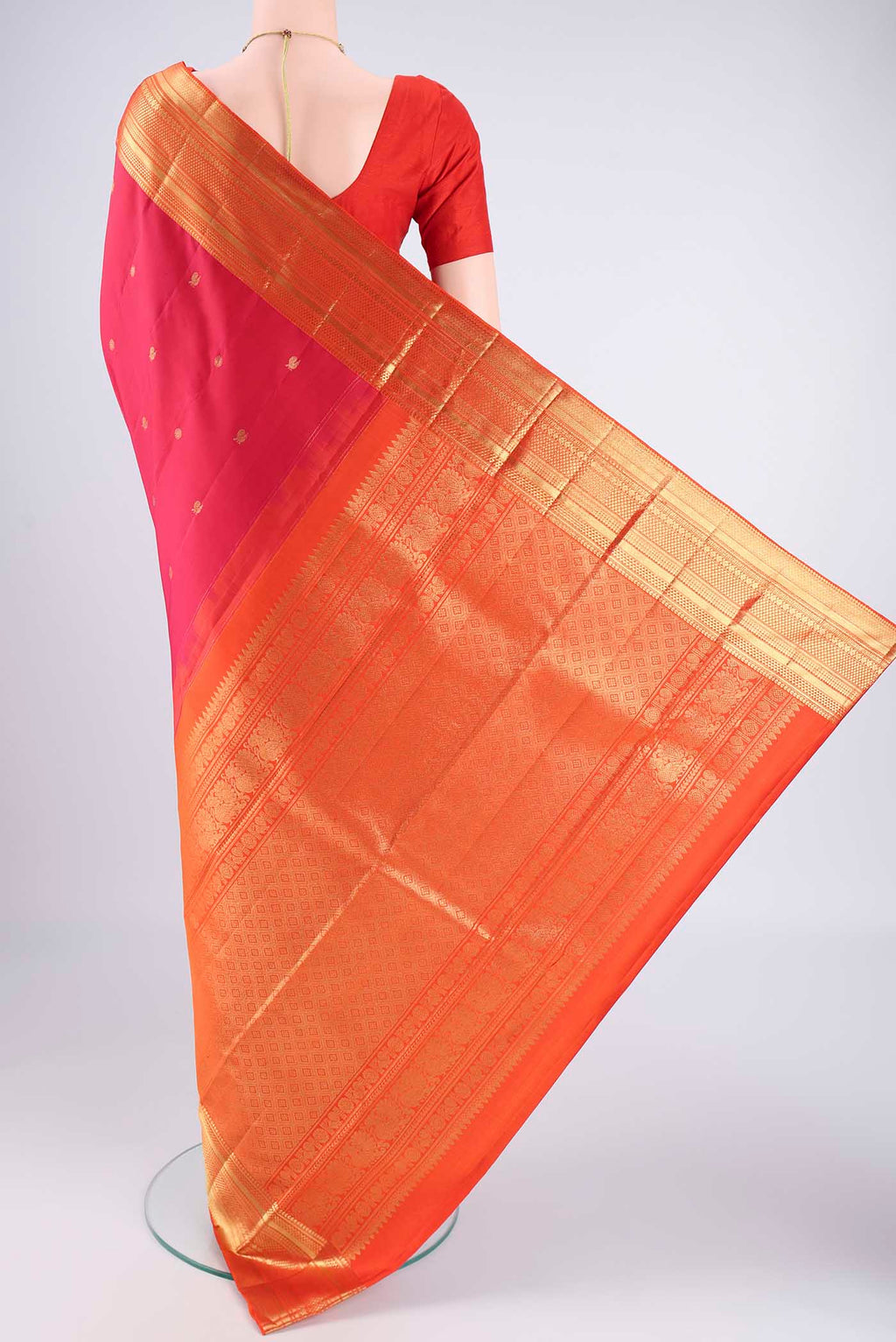 Flat view of Pure Silk Pure Zari Dark Pink Kanchipuram Saree with Zari Butta on the body and Zari Border. 