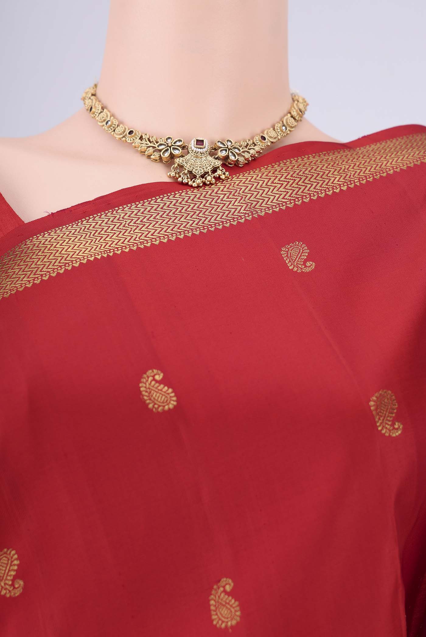 Border image of Pure Silk Pure Zari Red Kanchipuram Saree with Zari Butta on the body and Zari Border. 