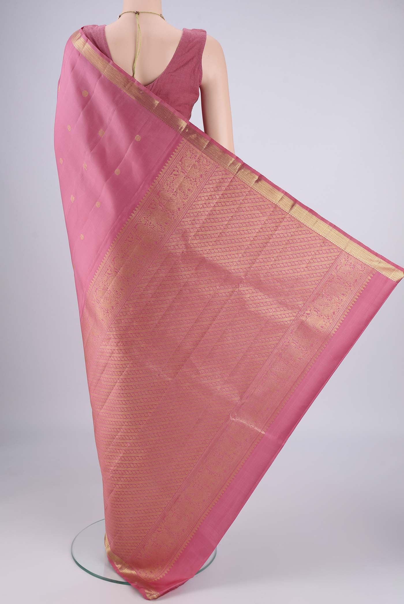 Flat view of Pure Silk Pure Zari Pink Kanchipuram Saree with Zari Butta on the body and Zari Border. 