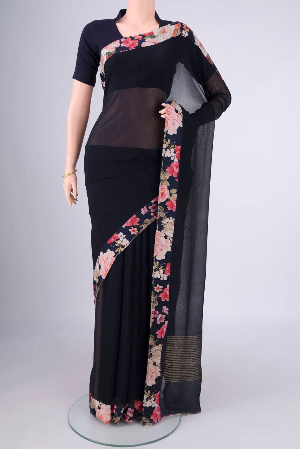 Navy Blue Mysore Chiffon Saree with Plain Body and Printed Border.  displayed on a mannequin